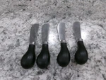 Trudeau Cheese Spreader Knife's, Set Of 4, Black Handle, Stainless Steel Blade. Fixed Price $12.02.