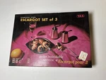 Vintage Yax Stainless Steel Escargot Set Of 3 Snail Plates Tongs And Picks. Fixed Price $13.59.