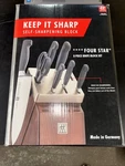 Zwilling Four Star 8-PC Self-sharpening Knife Block Set. Fixed Price $275.00.