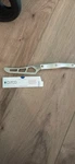 New Cutco 1764 White Handled Serated Cheese Knife. Fixed Price $90.00.