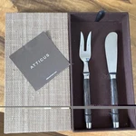 New Atticus Cheese Knife & Fork Set Stainless Steel Wood Handles Woven Gift Box. Fixed Price $60.00.