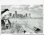 1987 Press Photo Tow Truck Pulls Pick-up Out Of Water Near Pier Four In Boston. Fixed Price $24.99.