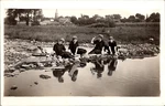 Pretty Girls In Dark Clothes Sit Stones Waters Edge Rppc Postcard 26149. Fixed Price $19.95.