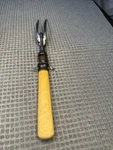 Antique Meat Carving Fork Stand Celluloid? Handle. Fixed Price $8.00.