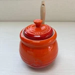 Le Creuset Honey Pot Color Orange Ceramic With Stick Used. Fixed Price $114.00.