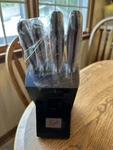 Knife Set Emeril Lagaee 4 Knives In Block. Fixed Price $21.00.