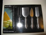 Metalla Set Of 4 Cheese Knives,new,sealed. Fixed Price $10.00.