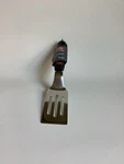 Oxo Good Grips Softworks Cut & Serve Turner. Fixed Price $17.99.