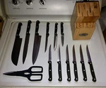 Ginsu Gourmet Stainless Steel Knife Set W/ Wood Stand (12 Knives & Shears). Fixed Price $99.99.