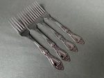Four Dinner Forks Oneida Huntington Wm Rogers Deluxe Stainless Glossy 7 1/4". Fixed Price $24.00.