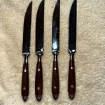 Vintage Danesco Bistro Dinner Knives Stainless Woodgrain Handles Set Of 4. Fixed Price $25.00.