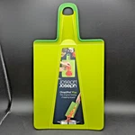 Joseph CHOP2POT+ Foldable Plastic Cutting Board Easy Grip Handle. Fixed Price $13.99.