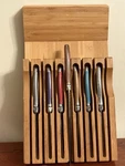Laguiole Jean Debost 7 Knives 5 Resin Steak 1 Metal & Olive Wood Kitchen. Fixed Price $75.00.