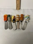 Boston Warehouse Various Characters Spread Knives Lot Of Six. Fixed Price $12.00.