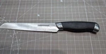 Farberware Serrated Bread Knife W/ Rubberized Grip 7.5" Blade Used Good. Fixed Price $8.99.