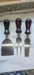 Trudeau 3 Piece Cheese Board Knife Set Sold As Is. Wood Handle Stainless Steel. Fixed Price $12.00.