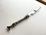 Carrol Boyes Serrated Cheese Knife With Bottle Opener Fish Tail, Scales. Fixed Price $69.99.