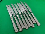 Set 8 Waterford Stainless Steel Carleton Dinner Knives. Fixed Price $79.99.