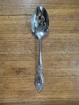 Oneida Stainless Flatware Plantation Pierced Serving Spoon 3/8 Inches. Fixed Price $16.00.