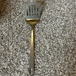 Wolfgang Puck Stainless Steel Kitchen Utensils Spatula, Slotted Bistro. Fixed Price $9.99.