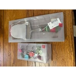 Celebrate & Decorate Cheese Cutter And Russ Holiday Wine Charms Set. Fixed Price $15.00.