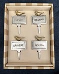 Boxed Set Of Four Bombay Metal Cheese Markers With Brass Colored Birds Euc. Fixed Price $15.00.