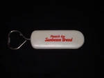 Reach For Sunbeam Bread Bottle Opener With Two Red Caps Collectible Item. Fixed Price $8.88.