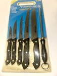 Generation 7 Piece German Style Knife Set 5 Knives, Sharpening Tool & Cutting Bd. Fixed Price $12.98.