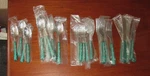 Oneida Holiday Colormates 20 Piece Flatware Set & Tin Christmas Green. Fixed Price $10.00.